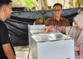 Pj Bupati Nagan Raya dan Istri Gunakan Hak Pilihnya di TPS I Lueng Baro